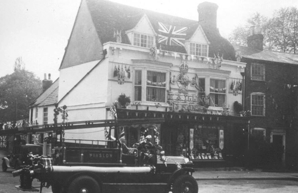 The modern fire engine in front of Illings' shop